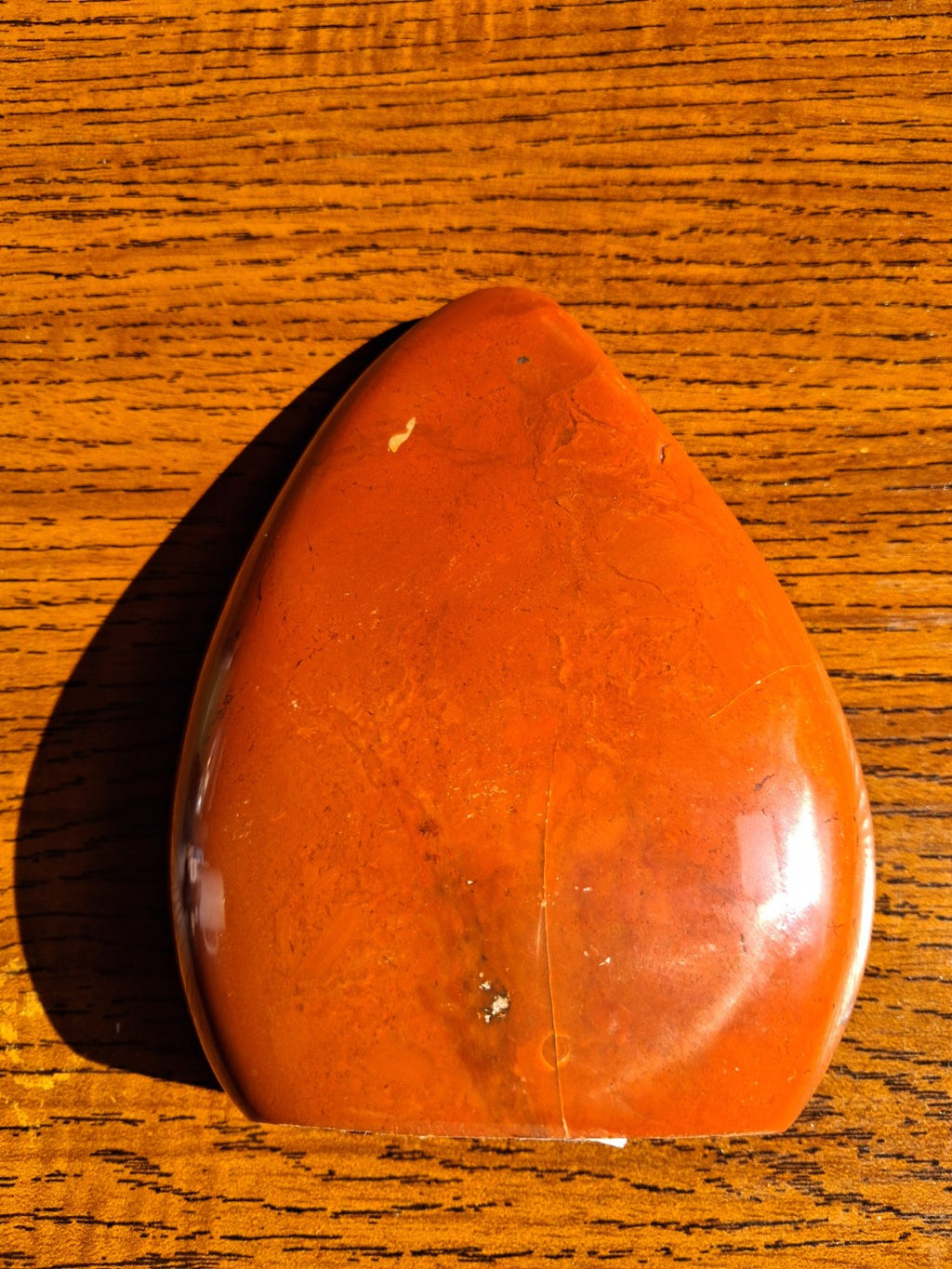Red Jasper large decorative freeform angled back showing polished brick red surface