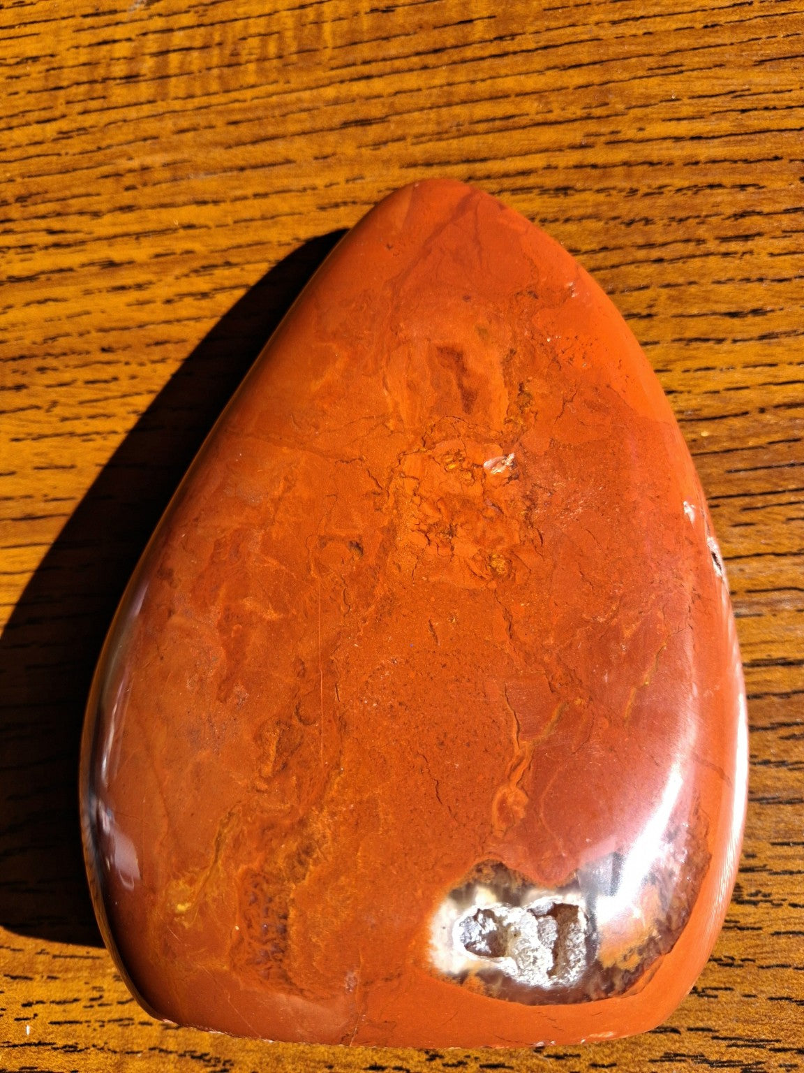 Red Jasper macro image showing contrasting natural pale mineral patch close-up