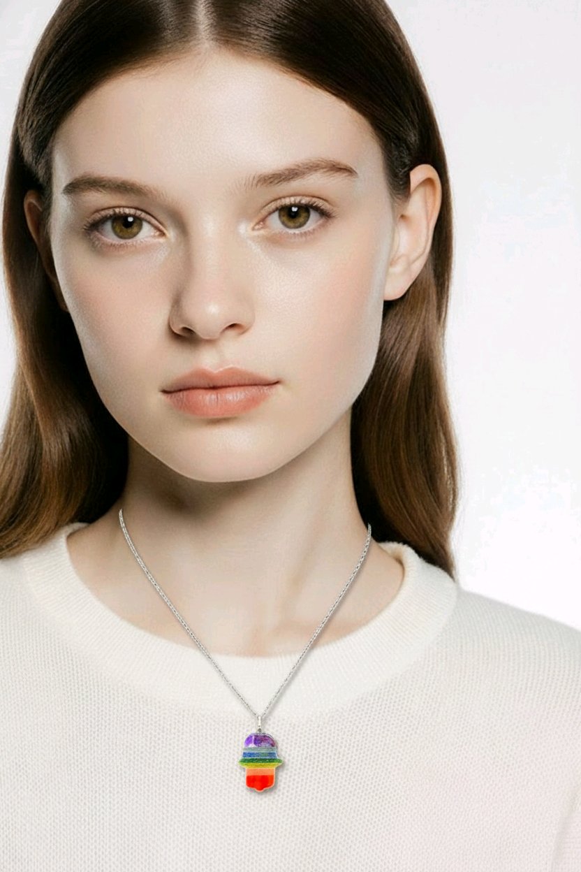 Beautiful 7 chakra bonded gemstone Hamsa pendant, approx. 1.5 inches. Hand-shaped design with layered chakra stones for protection, harmony, and positive energy – perfect spiritual jewelry.